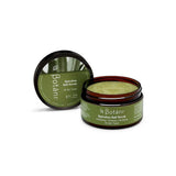 A 250g jar of Botani Spirulina Salt Body Scrub sits open, revealing its green scrub with Australian Sea Salt. Suitable for all skin types.