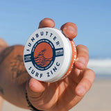 SunButter Vegan Surf Zinc SPF50 held at the beach