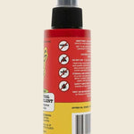 Bug-Grrr Off 100% Natural Insect Repellent Jungle Strength Spray comes in a red bottle with a black cap, back label warning icons and instructions, plus images of mosquitoes, flies, and ticks it effectively repels.