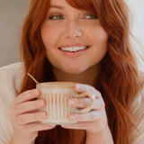 Woman enjoying Nutra Naturals Collagen Beauty Caramel