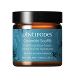 A jar of Antipodes Ceramide Soufflé Fresh Hydration Cream, featuring an amber glass jar with a black lid and a blue label with white text.
