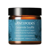 A jar of Antipodes Ceramide Soufflé Fresh Hydration Cream, featuring an amber glass jar with a black lid and a blue label with white text.