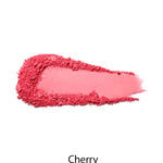 A thick, uneven swatch of 100% Pure Fruit Pigmented® Blush 9g by 100% Pure in the shade Cherry is spread in bright pink on a white background.
