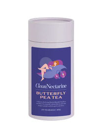 A pale purple cylinder of Clean Nectarine Butterfly Pea Tea with a vibrant purple and blue label featuring an illustrated woman relaxing among butterfly pea flowers. Contains 25 teabags of butterfly pea flower and white tea that naturally change from blue to purple with lemon.