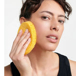 Model using the Dr Hauschka Oval Cleansing Sponge