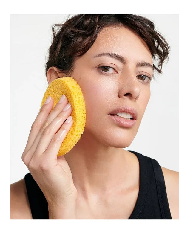 Model using the Dr Hauschka Oval Cleansing Sponge