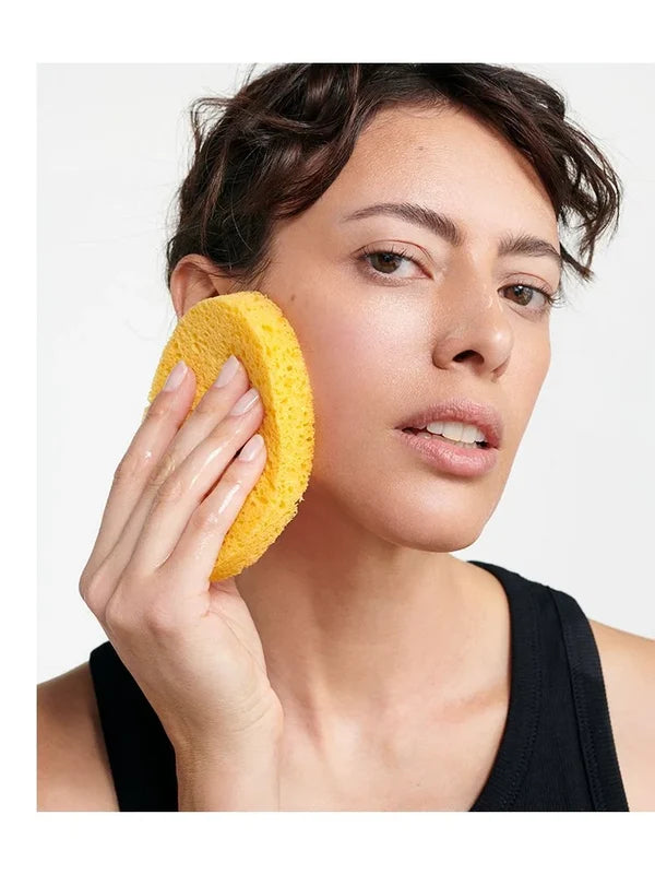 Model using the Dr Hauschka Oval Cleansing Sponge