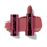 A tube of 100% Pure Pomegranate Oil Moisturising Lipstick 4.5g in a metallic pink-floral case, shown open with lipstick and a swatch of deep, neutral pink-nude behind it. Text below reads: Clover, infused with pomegranate oil.