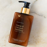 Vanessa Megan Cocoa and Coconut Soothing Hand and Body Cream pump bottle on marble