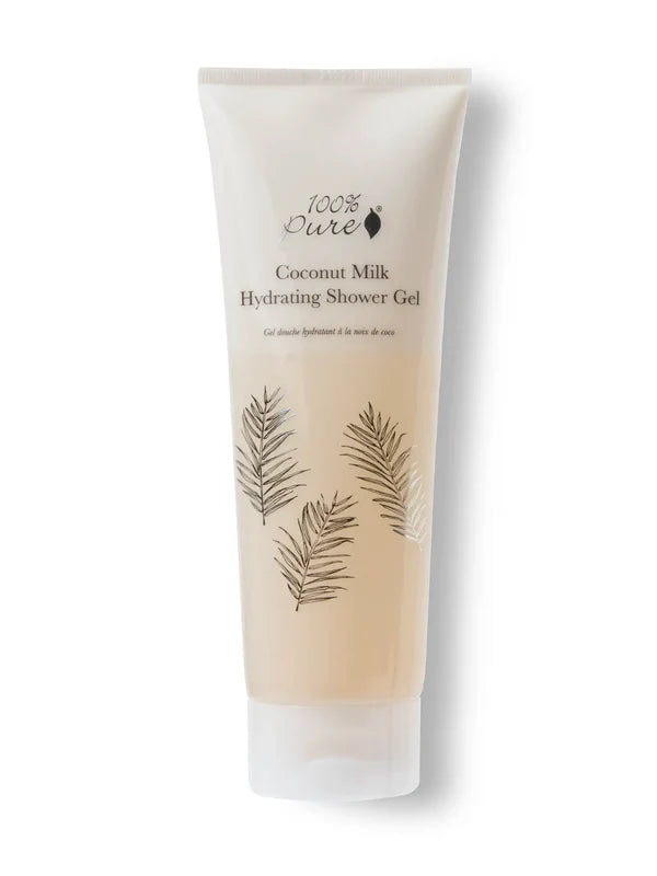 A pale beige 100% Pure Coconut Milk Hydrating Shower Gel tube stands on a translucent flip-top cap. Fine dark palm-frond drawings decorate the front below the product name.