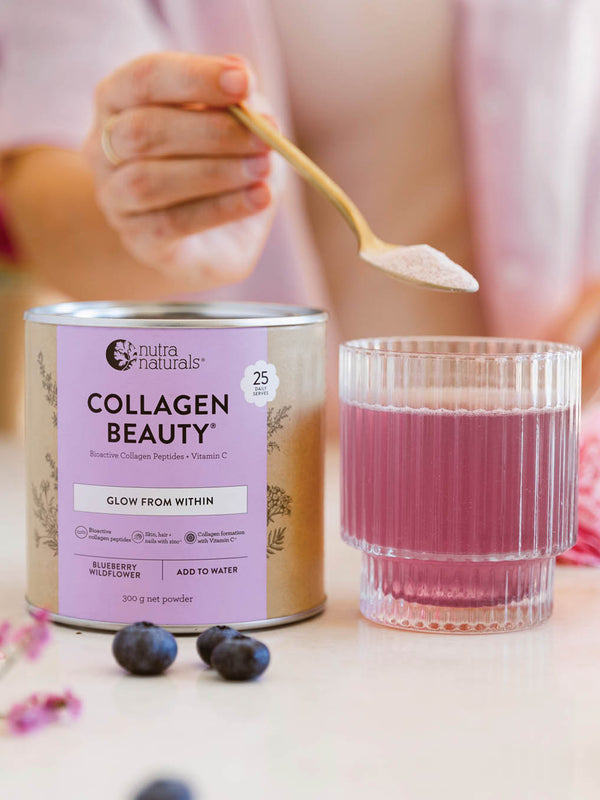 Nutra Naturals Collagen Beauty Blueberry Wildflower poured into glass