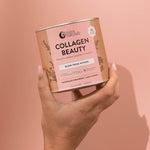 Hand holding Nutra Naturals Collagen Beauty Watermelon Strawberry 225g