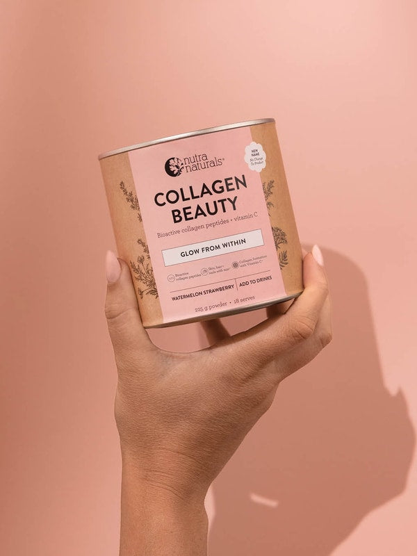Hand holding Nutra Naturals Collagen Beauty Watermelon Strawberry 225g