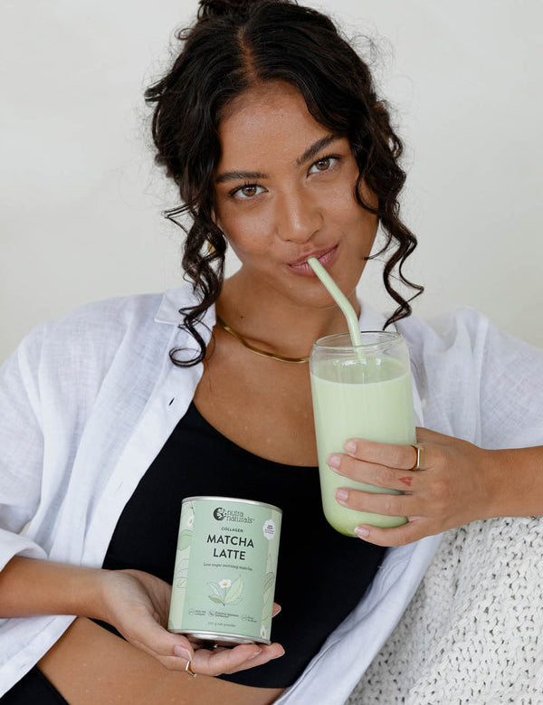 Woman with an iced Nutra Naturals Collagen Matcha Latte