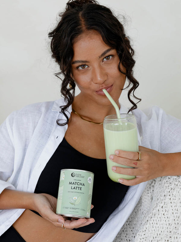 Woman with an iced Nutra Naturals Collagen Matcha Latte