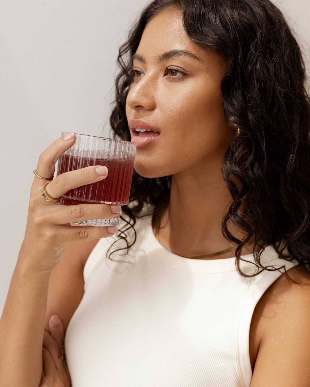 Woman enjoying Nutra Naturals Collagen Beauty Watermelon Strawberry