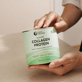 Hands holding Nutra Naturals Collagen Protein 450g