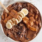 Cookie dough smoothie bowl made with Nutra Naturals Clean Plant Protein Smooth Chocolate