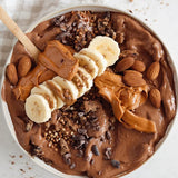 Cookie dough smoothie bowl made with Nutra Naturals Clean Plant Protein Smooth Chocolate