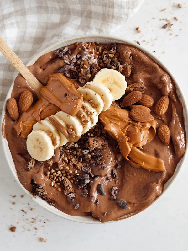 Cookie dough smoothie bowl made with Nutra Naturals Clean Plant Protein Smooth Chocolate