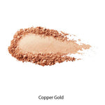A swatch of 100% Pure Fruit Pigmented® Gemmed Luminiser 9g in shimmery copper gold is shown on a white background, labeled Copper Gold. This 100% Pure product imparts a radiant, natural glow to your complexion.