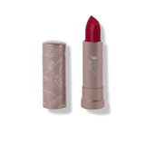 100% Pure Cocoa Butter Matte Lipsticks 4.5g in Currant: a vegan matte berry red shade with cocoa butter for comfort, in a taupe tube with floral designs. Shown uncapped next to lipstick. Text: Currant (A berry red, matte, opaque).
