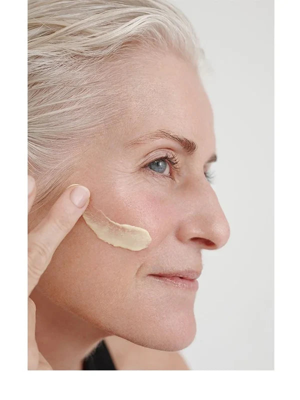 Model applying Dr Hauschka Regenerating Day Cream Intensive