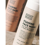 Close-up of Noosa Basics Foaming Face Wash bottles, with the acne-prone skin formula in front.