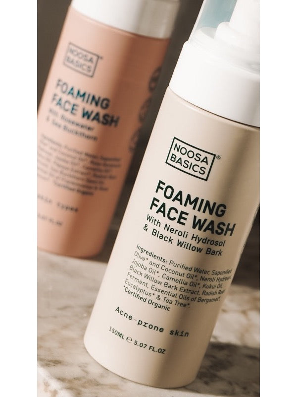 Close-up of Noosa Basics Foaming Face Wash bottles, with the acne-prone skin formula in front.
