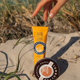 SunButter SPF50 sunscreen on beach