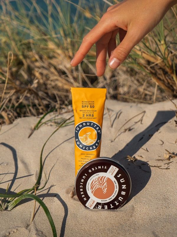 SunButter SPF50 sunscreen on beach