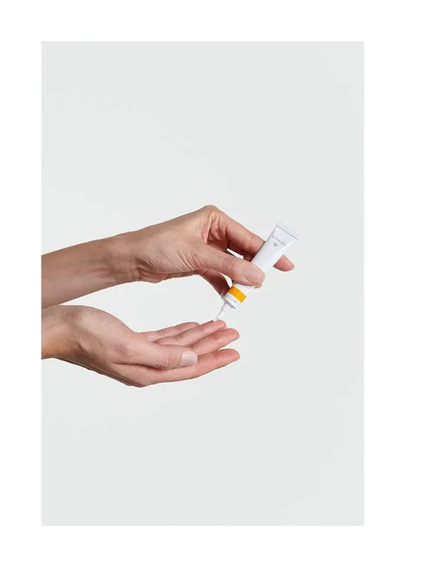 Hands holding Dr Hauschka Daily Hydrating Eye Cream