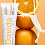 Davids Orange and Vanilla Toothpaste styled with fresh oranges