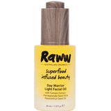 A 30ml bottle of Raww Day Warrior Light Facial Oil with a yellow gradient design and wooden-textured cap; label features tomato extract, pomegranate seed oil, and passionfruit seed oil.
