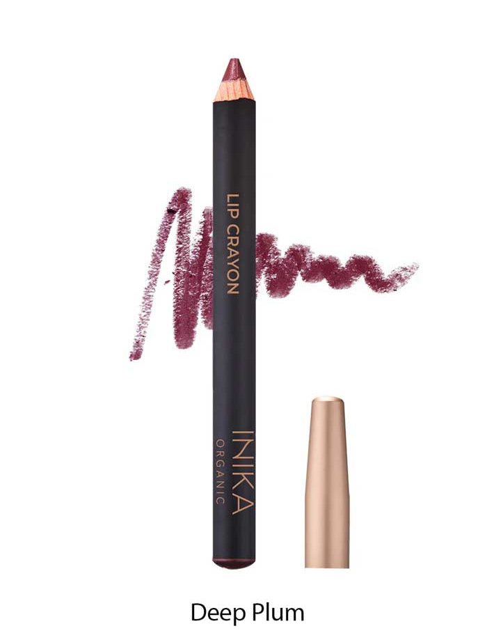 A dark plum organic INIKA Organic Lip Crayons 6.7g with a gold cap is shown beside a plum scribble and the label "Deep Plum." This vegan lip crayon is labeled as INIKA Organic.