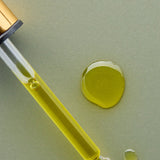 Golden oil and dropper of Antipodes Divine Rosehip and Avocado Face Oil