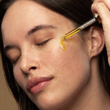 Model applying Antipodes Divine Rosehip and Avocado Face Oil