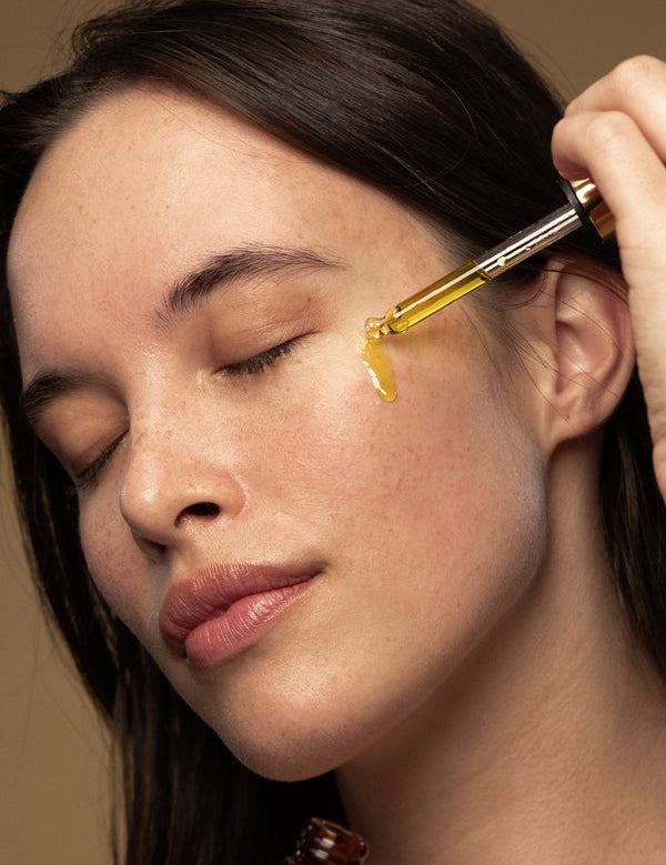 Model applying Antipodes Divine Rosehip and Avocado Face Oil