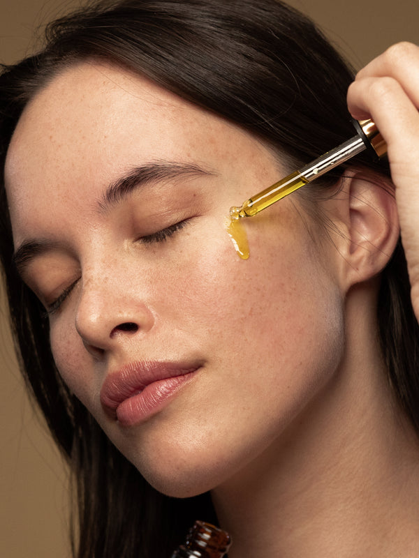 Model applying Antipodes Divine Rosehip and Avocado Face Oil