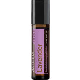 doTERRA Lavender Touch roll-on in a slim amber bottle with a tall black cap and a pale purple label with brown lettering.