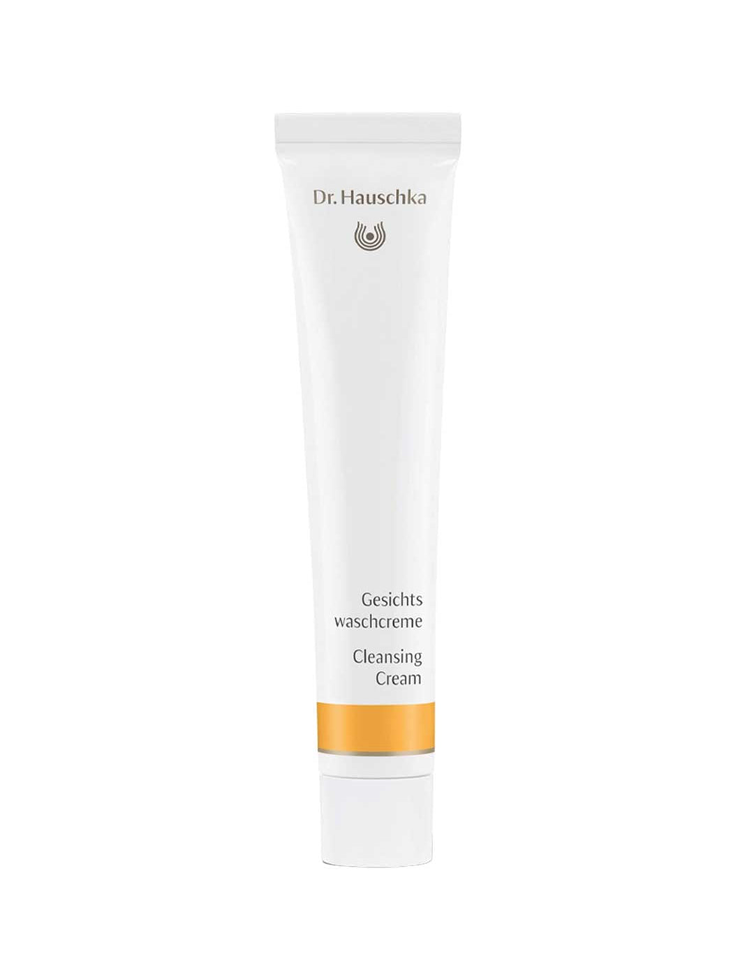 A white 50ml tube of Dr Hauschka Cleansing Cream—a natural cleanser with gentle exfoliation—features gold accents and bilingual text on the front, standing upright against a plain white background.