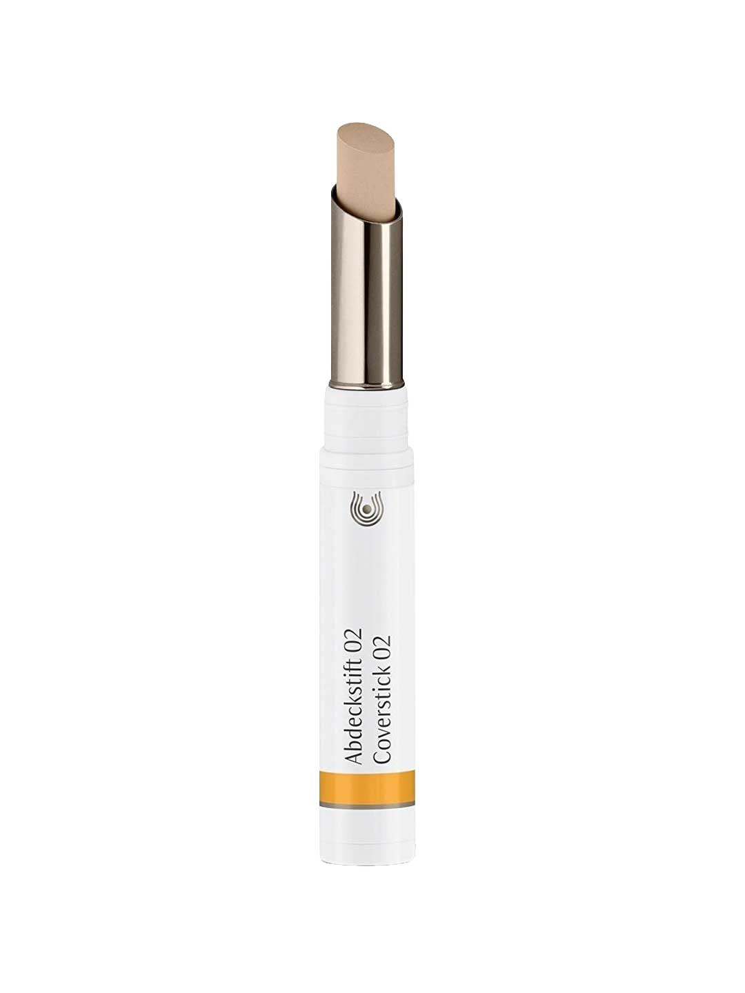 The Dr Hauschka Coverstick 2g is a beige natural concealer in a white tube with a silver twist-up base and yellow accent, ideal for targeted blemish coverage.