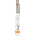 The Dr Hauschka Coverstick 2g is a beige natural concealer in a white tube with a silver twist-up base and yellow accent, ideal for targeted blemish coverage.
