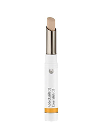 The Dr Hauschka Coverstick 2g is a beige natural concealer in a white tube with a silver twist-up base and yellow accent, ideal for targeted blemish coverage.