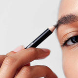 A close-up shows someone using Dr Hauschka Eyebrow Definer 1.05g to fill in their brows, with the text “Colour: 02 darkbrown” displayed in the bottom left corner.