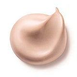 Dr Hauschka Illuminating Fluid 30ml, a shimmery light beige hydrating highlighter with a smooth texture and pointed tip, is displayed against a white background.