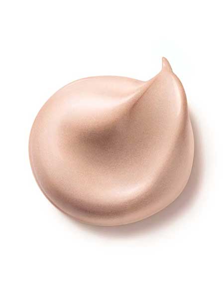 Dr Hauschka Illuminating Fluid 30ml, a shimmery light beige hydrating highlighter with a smooth texture and pointed tip, is displayed against a white background.