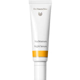 Dr Hauschka Night Serum 20ml—presented in a white tube with gold accents and bilingual labeling—stands upright against a white background, ideal for overnight renewal in your natural skincare routine.