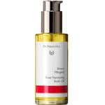 Dr Hauschka Rose Nurturing Body Oil 75ml comes in a clear bottle with a pump dispenser and a white label featuring gold and red accents. This natural, golden-yellow oil is ideal for nourishing sensitive skin.