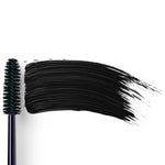 Dr Hauschka Volume Mascara 8ml is displayed with its black bristle wand beside a bold swipe of mascara on a white background, ideal for sensitive eyes.